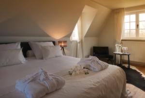 Postel nebo postele na pokoji v ubytování B&B Colombe Blanche