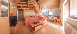 a living room with a couch and a staircase at Holiday home in Mirna Kranjska Krain 36158 in Mirna