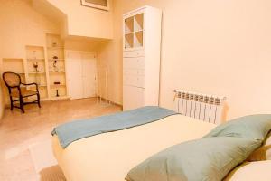 A bed or beds in a room at Apartamento J COSTA 15- Alameda Hércules