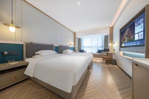 Guangzhou Baiyun Airport MeHood Liz Hotel Free Shuttle Bus To Airport客房内的一张或多张床位