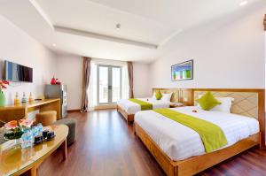 Postel nebo postele na pokoji v ubytování Richico Apartments And Hotel