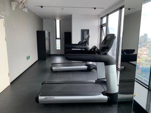 a gym with several treadmills in a building at 21B No.1 Best Location In Phnom Penh Capital, Swimming Pool & Gyms in Phnom Penh
