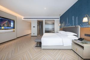 Guangzhou Baiyun Airport MeHood Liz Hotel Free Shuttle Bus To Airport客房内的一张或多张床位