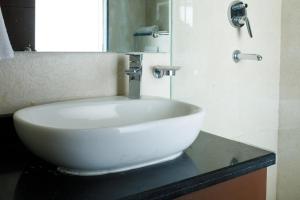 a white sink on a counter in a bathroom at Sangam City Hotel Pure Veg in Kathmandu