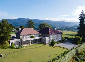 an aerial view of a house with a large yard at The Bellwood Manor in Nuwara Eliya