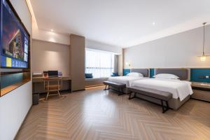 Guangzhou Baiyun Airport MeHood Liz Hotel Free Shuttle Bus To Airport客房内的一张或多张床位