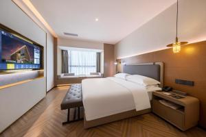 Guangzhou Baiyun Airport MeHood Liz Hotel Free Shuttle Bus To Airport客房内的一张或多张床位