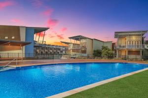 a large swimming pool in front of some buildings at South Shores Villa 50 in Normanville