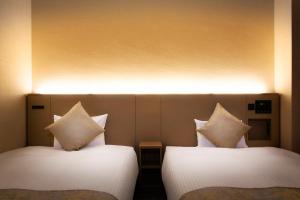 Postel nebo postele na pokoji v ubytování Hotel Villa Fontaine Tokyo-Kayabacho