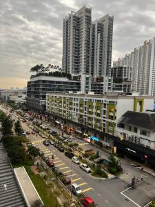 an aerial view of a city with tall buildings at Pacific Tower PJ Section 13 WifiParkingOppJayaOne Mall in Petaling Jaya