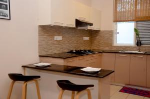 Kuchyň nebo kuchyňský kout v ubytování Square One CONDO - Kiribathgoda Kelaniya
