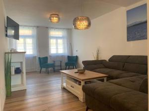 a living room with a couch and a table at Ferienwohnung MaRe in Stockach