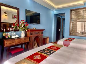 Кровать или кровати в номере Sapa Hills Hotel