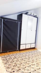 two sliding doors in a room with a rug at The Sunshine apartment in Prilep