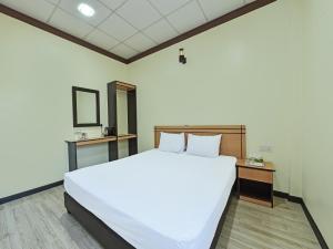 Кровать или кровати в номере Capital O 90761 D Jiwa Hotel