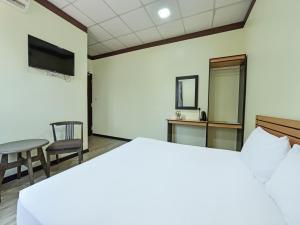 Ein Bett oder Betten in einem Zimmer der Unterkunft Capital O 90761 D Jiwa Hotel