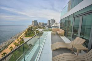 a balcony of a building with a view of the ocean at Batumi View Luxury in Batumi