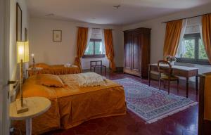 Postel nebo postele na pokoji v ubytování Villa Le Querciolaie