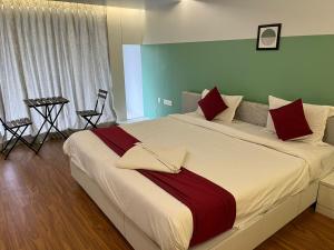 Postel nebo postele na pokoji v ubytování Hotel SV International