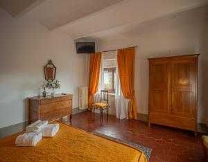 Postel nebo postele na pokoji v ubytování Villa Le Querciolaie