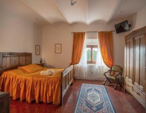 Postel nebo postele na pokoji v ubytování Villa Le Querciolaie + 37 fotografií