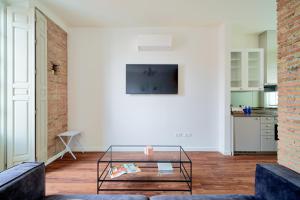 Televízia a/alebo spoločenská miestnosť v ubytovaní City Suite