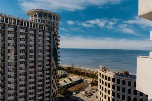 a view of the ocean from a building at Hotel 19 Batumi in Batumi