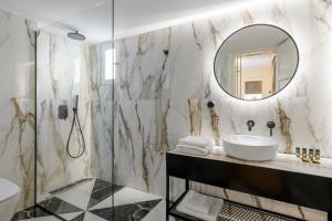 a bathroom with a sink and a mirror at Your 4 bdrm Dream House Acropolis View & Jacuzzi in Athens +25 photos