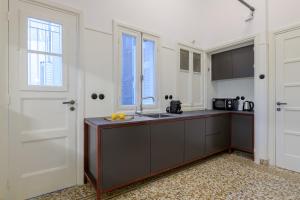 a kitchen with a sink and a counter top at Your 4 bdrm Dream House Acropolis View & Jacuzzi in Athens