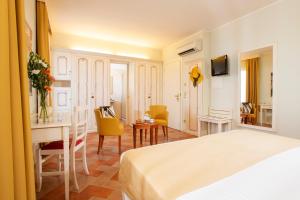 Postel nebo postele na pokoji v ubytování Antica Fornace Relais by La Principina