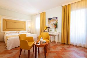 Postel nebo postele na pokoji v ubytování Antica Fornace Relais by La Principina