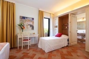 Postel nebo postele na pokoji v ubytování Antica Fornace Relais by La Principina