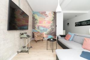 A television and/or entertainment centre at Moyua Luxe by Staynnapartments