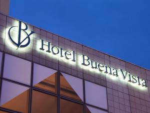 a hotel buffalo sign on the side of a building at Hotel Buena Vista in Matsumoto