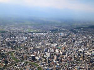 an aerial view of a city with many buildings at Hotel Buena Vista in Matsumoto