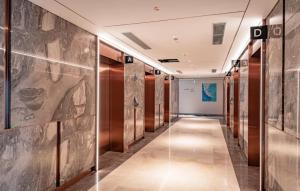 a hallway of a building with wooden walls at À La Carte Halong Bay in Ha Long