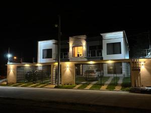 a house at night with lights on it at Apartamentos Orquidea Dorada apt 101 & 104 in Comayagua