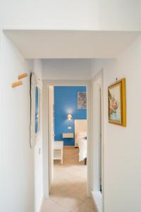 a hallway with a bedroom and a bed in a room at Monastero Santa Rosalia in Atrani