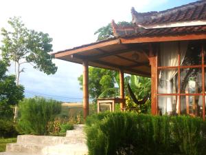 Zahrada ubytování RUMAH THEA + 37 fotografií