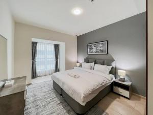 Postel nebo postele na pokoji v ubytování StoneTree - Elite Residence 1 BR - Near Dubai Tram