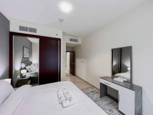Postel nebo postele na pokoji v ubytování StoneTree - Elite Residence 1 BR - Near Dubai Tram