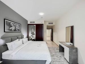 Postel nebo postele na pokoji v ubytování StoneTree - Elite Residence 1 BR - Near Dubai Tram