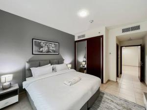 Postel nebo postele na pokoji v ubytování StoneTree - Elite Residence 1 BR - Near Dubai Tram