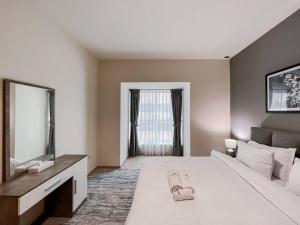 Postel nebo postele na pokoji v ubytování StoneTree - Elite Residence 1 BR - Near Dubai Tram