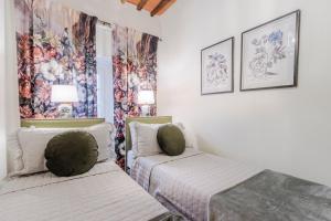 A bed or beds in a room at Iole