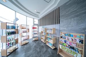 a store with shelves of products in a room at ホテル リッド 男塾ホテルグループ in Hikone