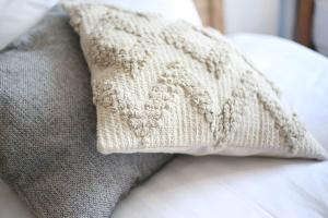 a white pillow sitting on top of a bed at Pirane House 201 東京スカイツリー浅草 押上駅が徒歩圏内 無料wifi in Tokyo
