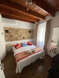 Postel nebo postele na pokoji v ubytování Lu Bàtil B&B - Rooms
