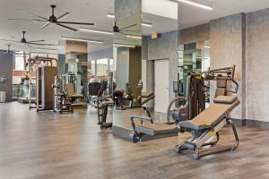 a gym with treadmills and elliptical machines at Jersey City 2BR w DM WD Gym shuttle to PATH NYC-866 in Jersey City