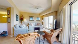 a living room with a couch and a table and chairs at Westwinds 4724 in Destin